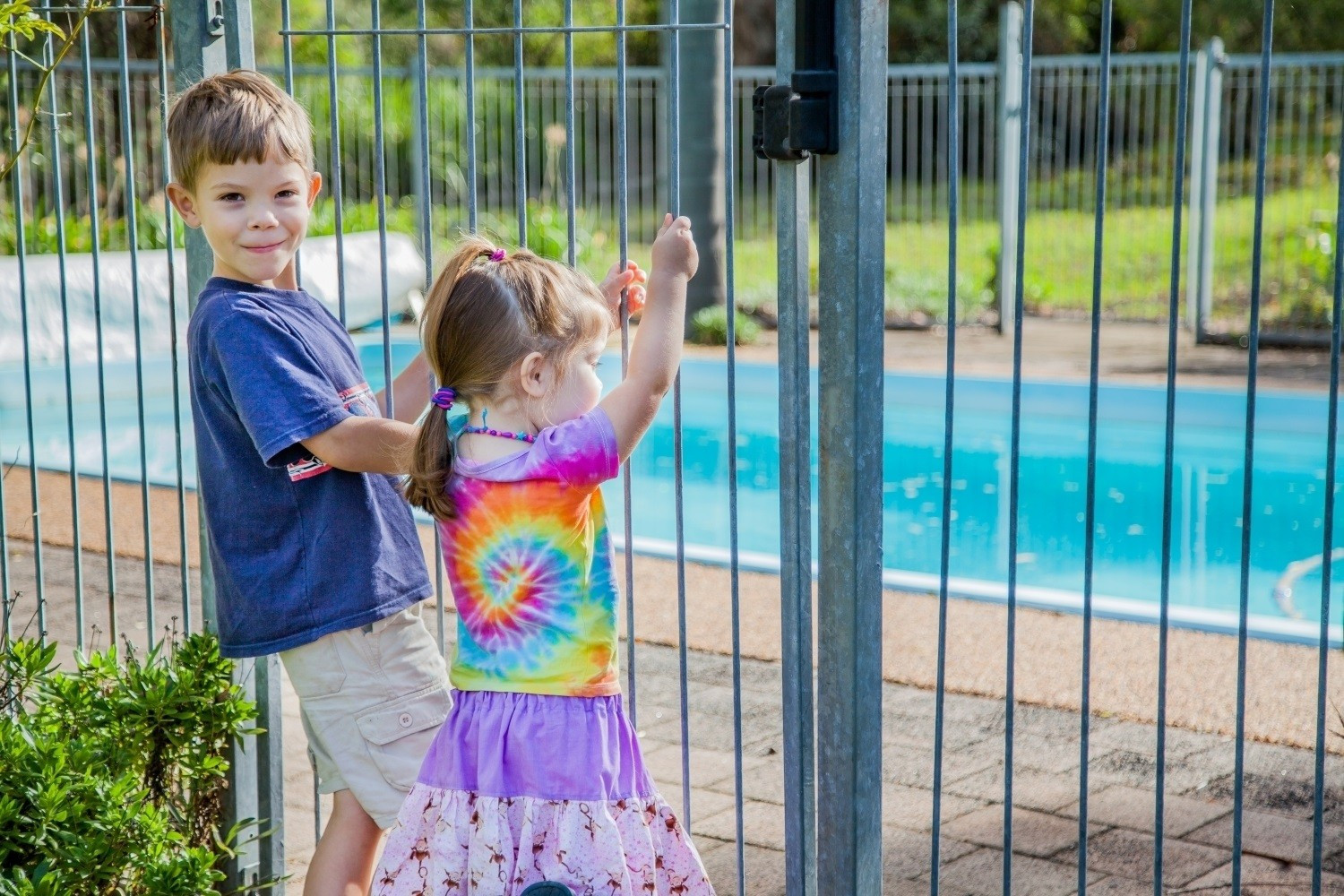 Warm weather sparks pool fence safety message - feature photo