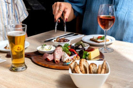 Share a platter on the deck overlooking the gardens