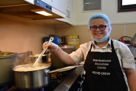 Rebecca manned the stoves to keep an eye on the pasta.	