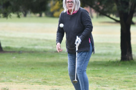 Fay Hutchison watches her ball fly onto the 14th green. 