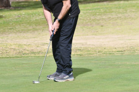 Greg James attempts a long putt at the sixth hole. 