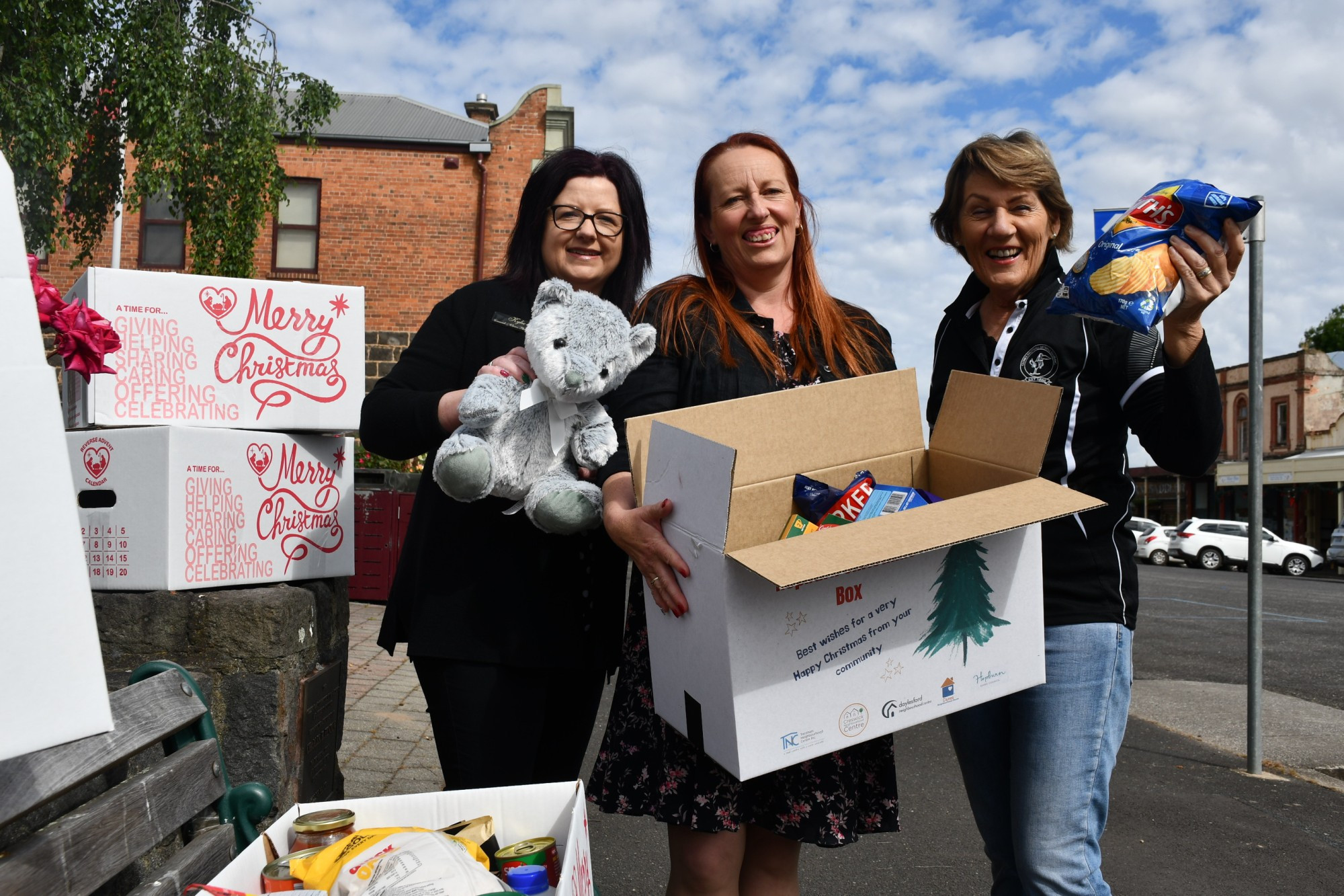 Creswick and Clunes Pharmacy retail manager Kylie Collings, Clunes Neighbourhood House manager Lana de Kort and Clunes Football Netball Club committee member Kath Milne are urging residents to donate to their Christmas cheer.