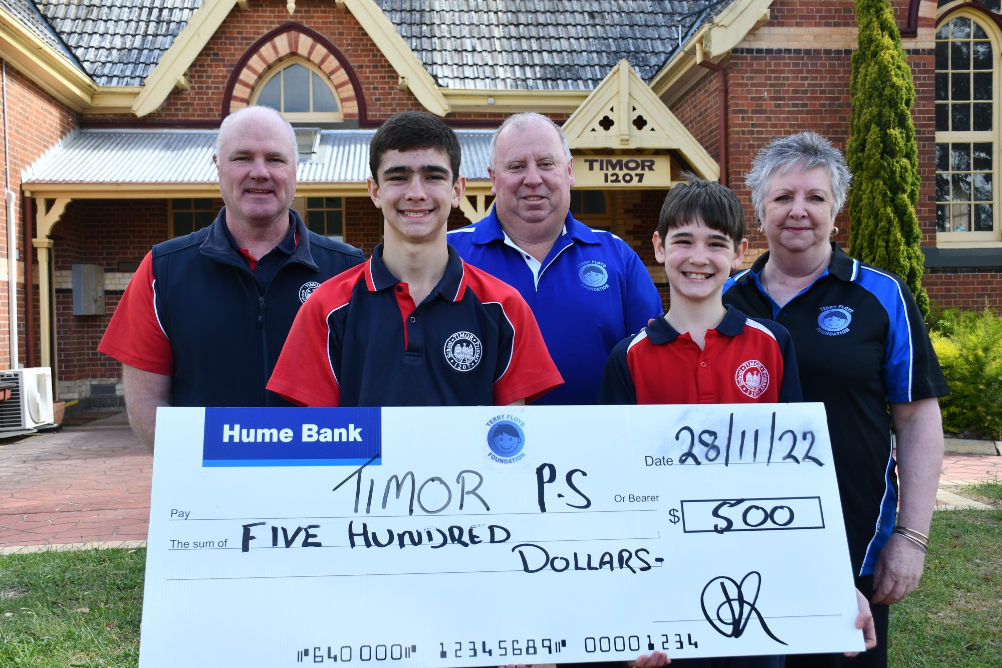 Timor Primary School principal Andrew Tatchell, students Darcy and Michael with the Terry Floyd Foundation’s Daryl Floyd and Sheryle Cain.