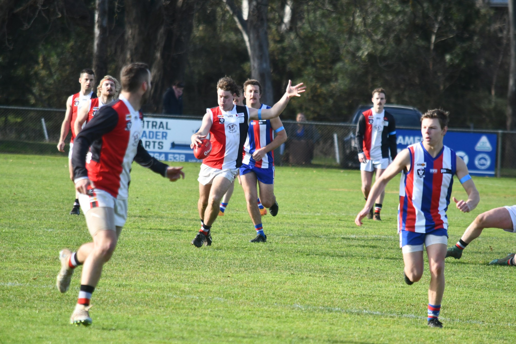 Tristan Newman kicks out of the backline for Trentham. The Saints maintained top spot on the MCDFNL ladder after a commanding 126-point victory over Avoca.