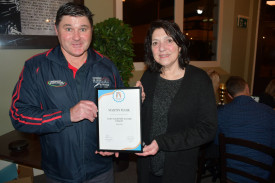 Club president, Martin Mark, was surprised when presented with a certificate for being a finalist in the state Club Volunteer Award from Triathlon Victoria by Jenny Barass.	