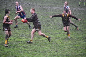 Daniel Romeo navigates the soggy ground to put Talbot into attack. 260722 14