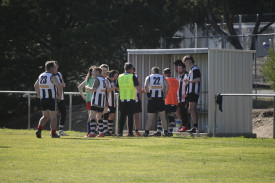 Maryborough huddles up for half time. 
