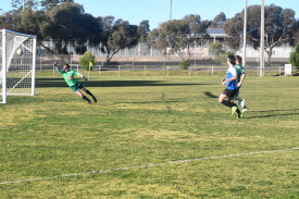 Seng Ngim slots one past the opposition keeper to score one of his two goals for the match.