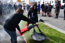 Maryborough Education Centre student Tahlia Spokes, who is currently undertaking a school-based traineeship at the Maryborough Police Station, helped cleanse the Aboriginal Flag. 