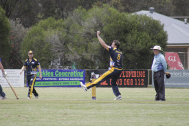 Laane’s Zach Graham steams in to bowl. 