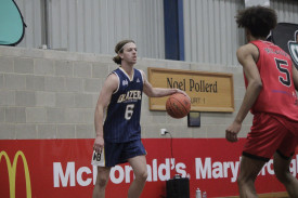 Darcy Bond looks to drive with the ball for the Blazers.