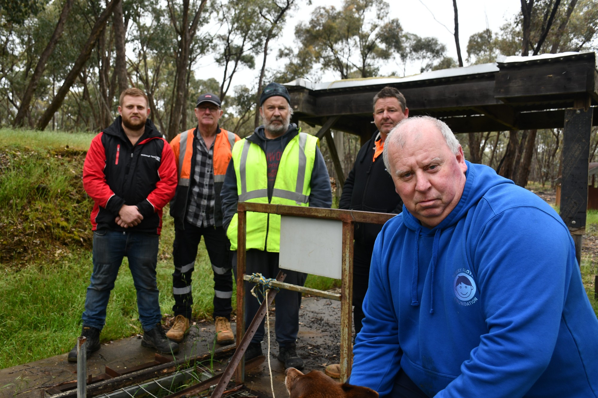 Nathan Ward, retired police detective Stewart Hulls, Troy Walker and Daryl Floyd have all been involved with the mine shaft search and met with mining expert Tony Gready (second from left) at the site this week.