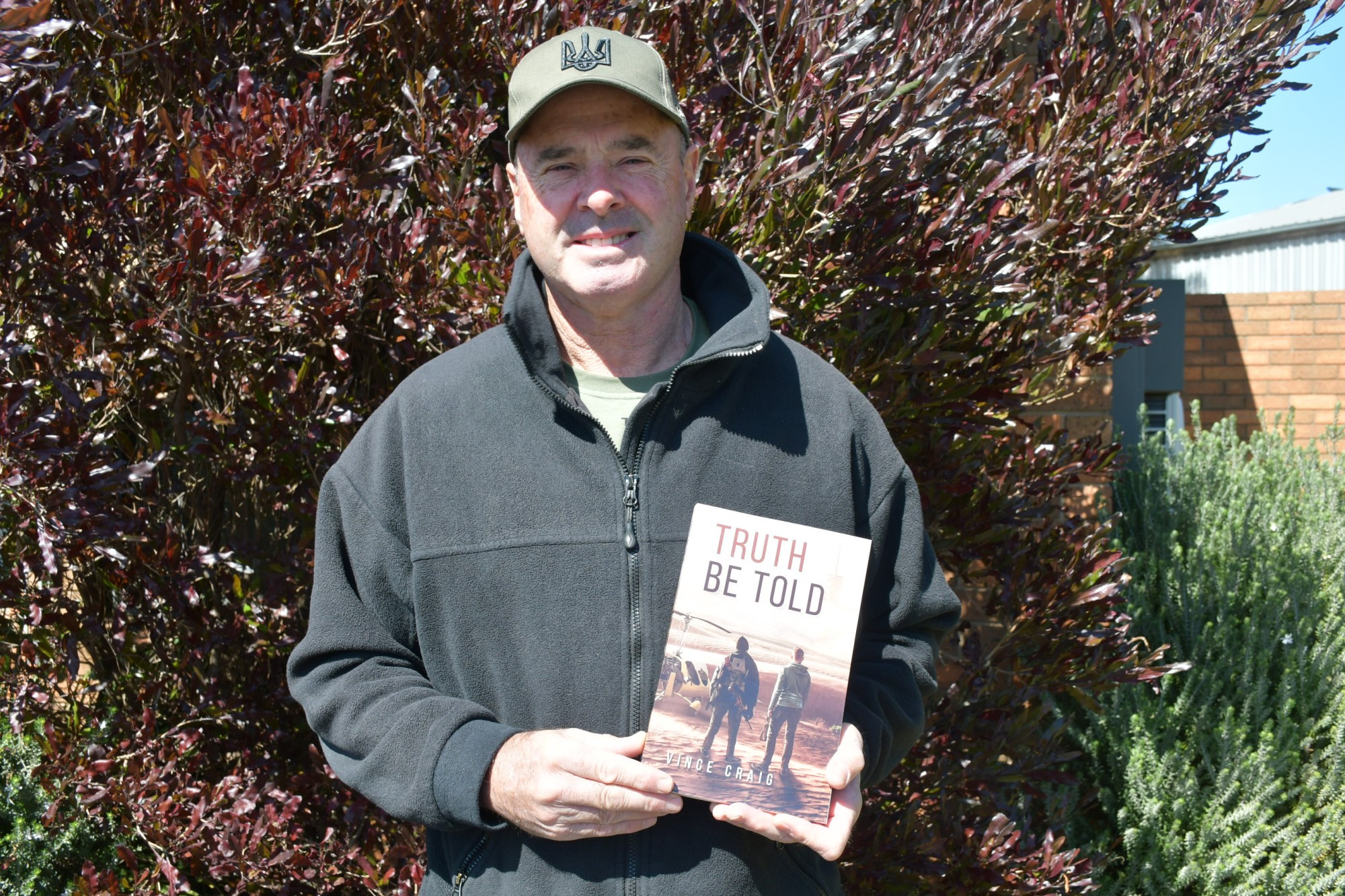 Craig Ellery with his new book, Truth Be Told.