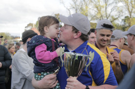 Senior Harcourt coach Dan Wridgeway and daugher Matilda following the Lions’ victory over Carisbrook.