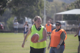 Nyaire Angel looks for a quick handball option for the Ravens. 060423 09