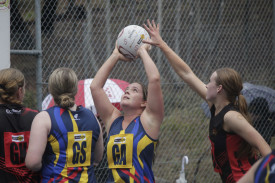 Dunolly goal attack Jess Donaldson puts up a shot under fierce Maldon pressure in the Eagles’ A grade win. Photo: 110423 07
