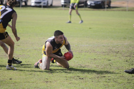 Michael Epworth got on his hands and knees to get the ball away for Royal Park. Photo: 250423 06