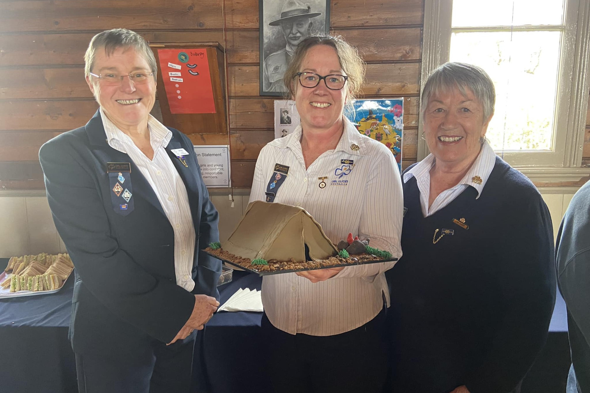 Maryborough Girl Guides’ Deb Apps and Lyn Curry celebrated with Belinda Pritchard (centre) after she was awarded the state-level Emu Award.