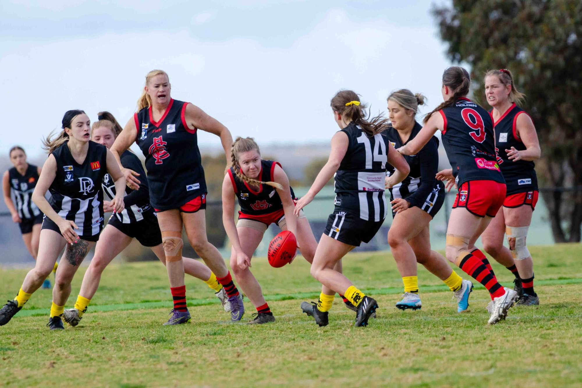 Caitlin Butler prepares to handball out of the gathering pack for Carisbrook, who will be taking on Lake Wendouree in their first final next weekend. Photo: 150823 14