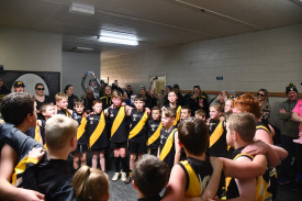 Royal Park’s under 11.5 footballers sing the song after defeating Talbot, securing a finals berth. Photo: 220823 27