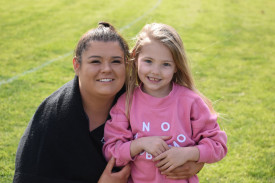 Sammi O’Connor and Isla James cheer on the footballers. Photo: 220823 10