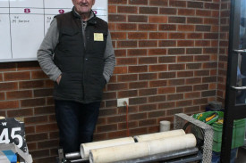 Lew Leslie with his bottle polishing/cleaning machine — his machine takes 250,000 turns over four days to clean up an old bottle. Photo: 010923 08