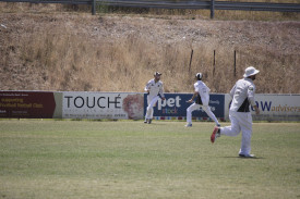 Clunes’ Aidan Thompson was up and about after taking a catch to remove Benjamin Gunn. Photo: 140223 03