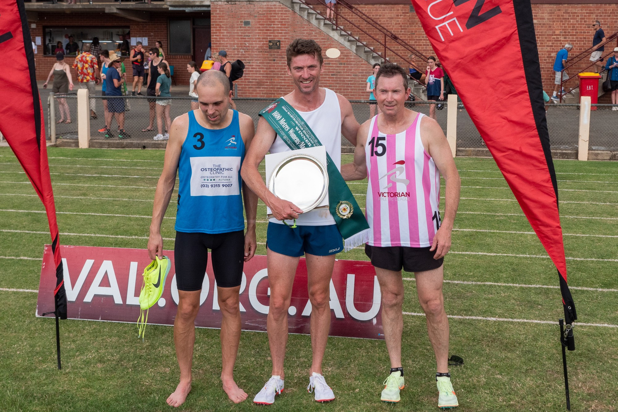 Womens /Masters 1600 m Final winner Nathan Crowley (centre).