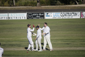Benjamin Gunn celebrates an important wicket just prior to the close of play for Laane. 