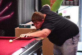 Bradey Tranter focuses intently as he looks to sink another shot. Photo: 270123 37