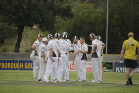 Clunes players celebrate the wicket of Harry Lumsden to end a 138-run stand. Photo: 310123 23