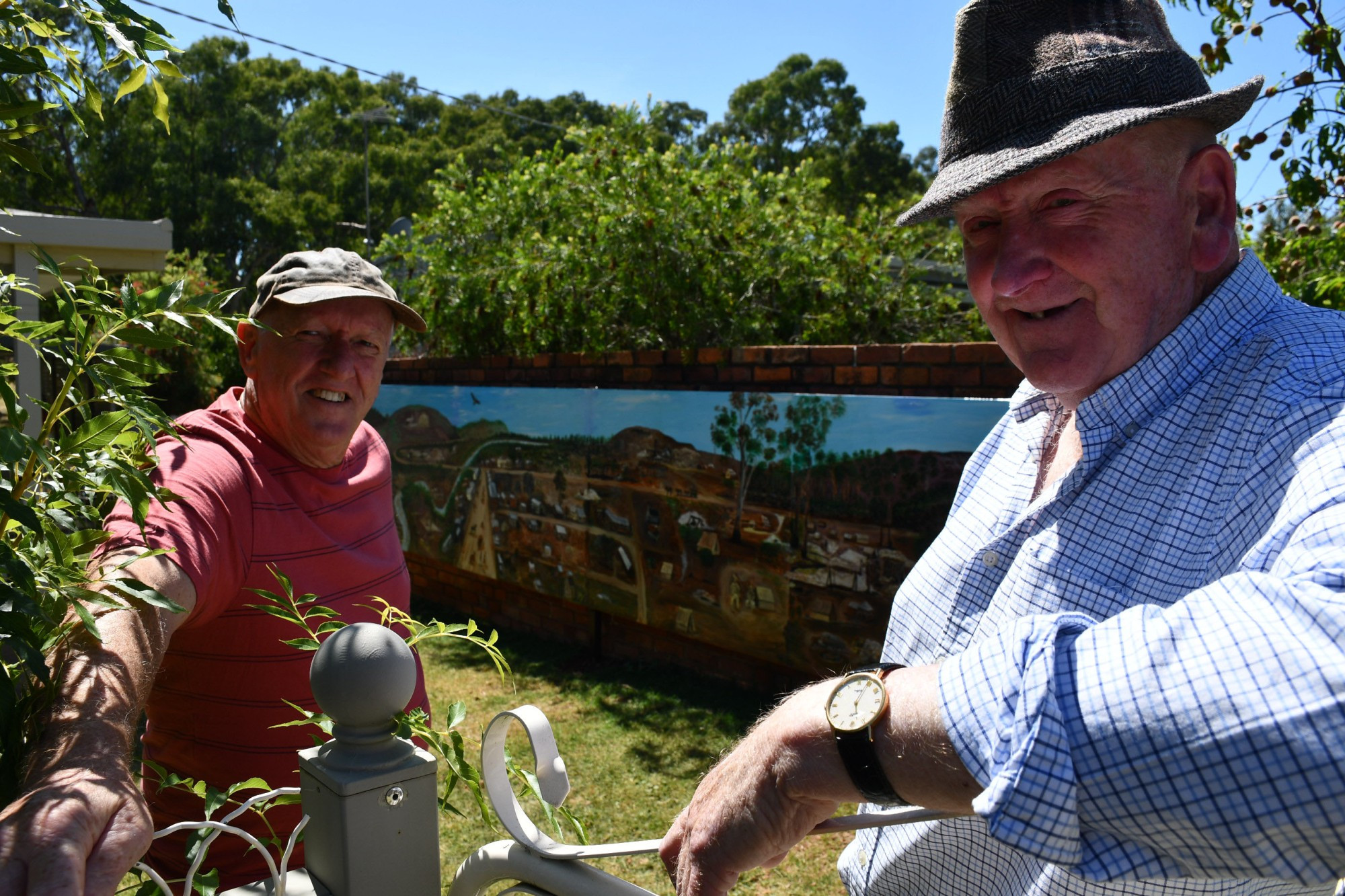 Carisbrook’s Steve Tennyson and John Moir in front of the newly installed mural, located in Bucknall Street. Photo: 310123 17