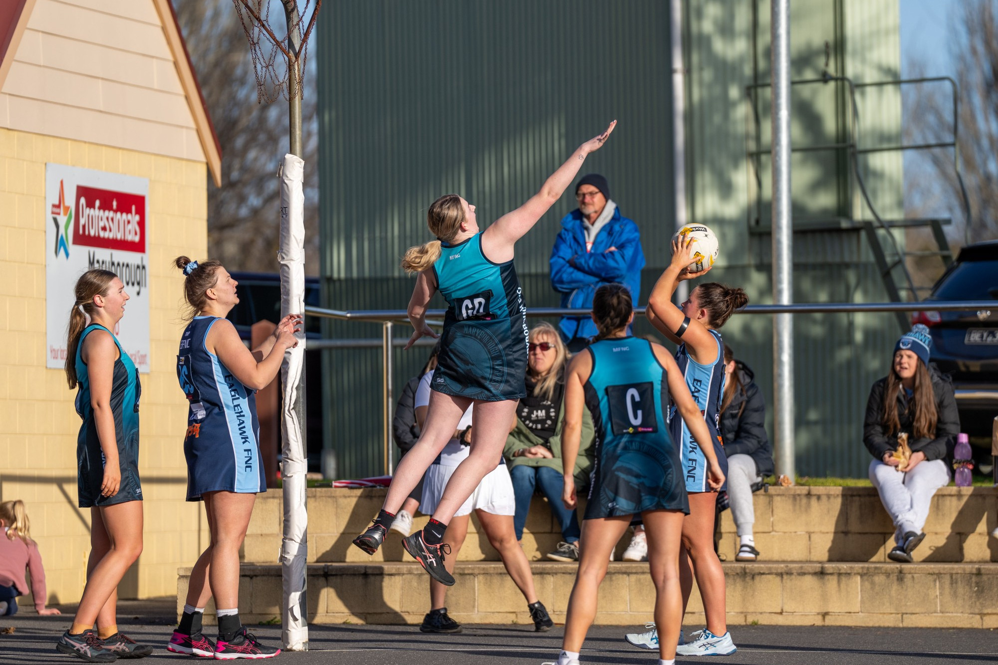 Alex Williams gets air in her attempts to block an Eaglehawk shot. Photo: 110723 14