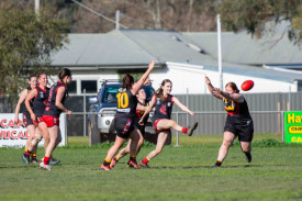Grace Love gets her kick away under pressure for Carisbrook. Photo: 180723 19
