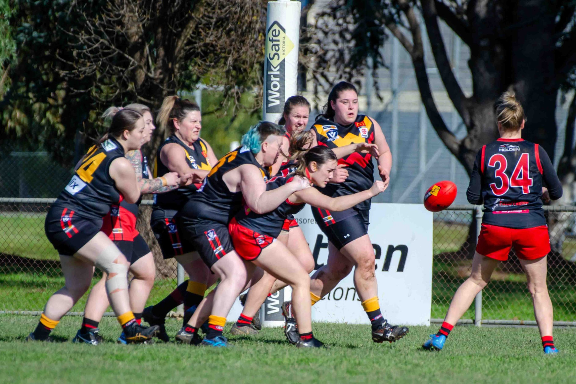 Tara Kennedy hand balls out of the pack for Carisbrook. Photo: 210723 15