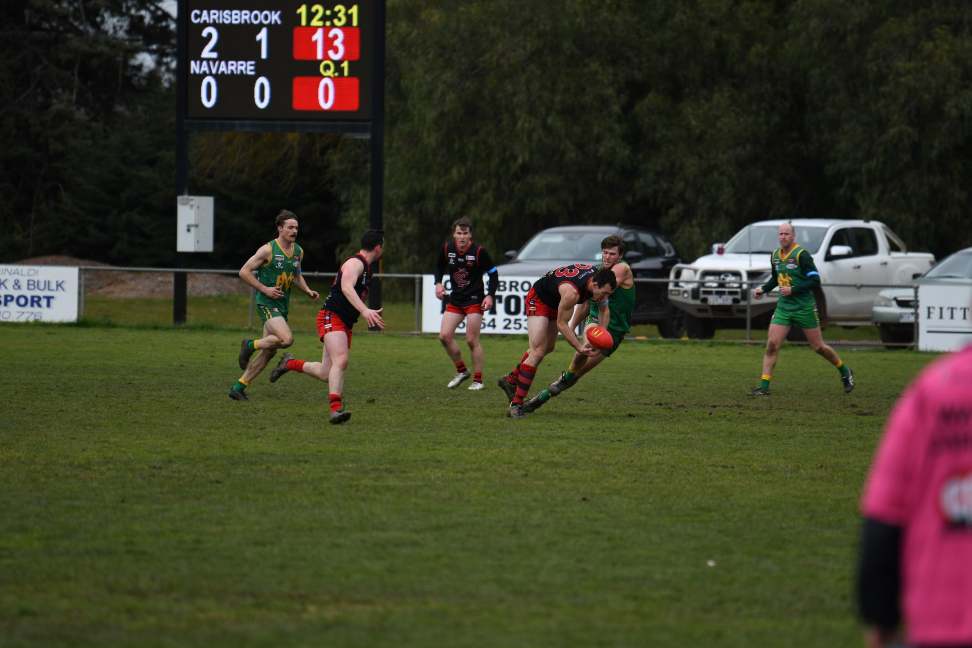 Carisbrook’s Jackson Bowen fends off some heavy Navarre pressure to get his handball away. Photo: 250723 16