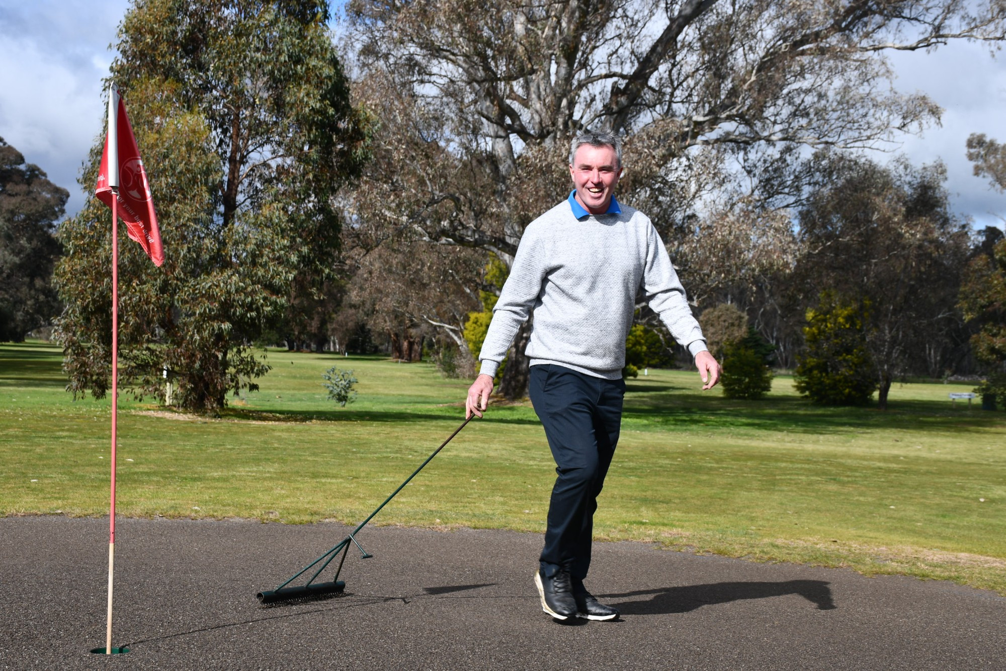 Talbot Golf Club captain Dean Ford showing the ropes around sand scraping on the greens. Photo: 010823 25