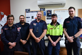 Local electrician Rhys Hendrickson, who donated his time to connect power to the MATS facility, with local paramedics Michael Scarlett, Jay Boucher, Joe McCallum and Jack Ross. 