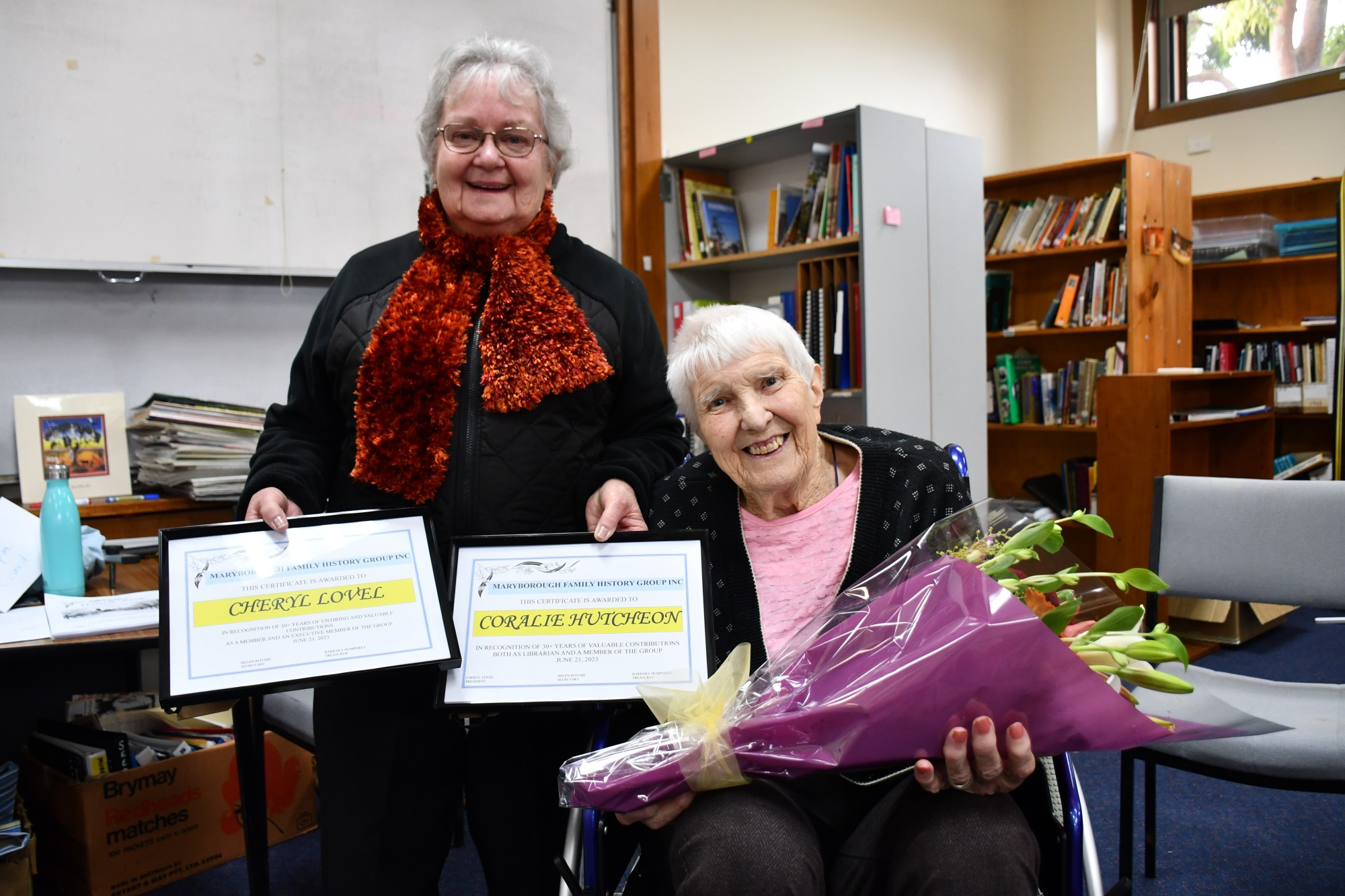 Cheryl Lovel and Coralie Hutcheon received certificates and flowers to mark their 30 plus years of involvement with the Maryborough Family History Group.