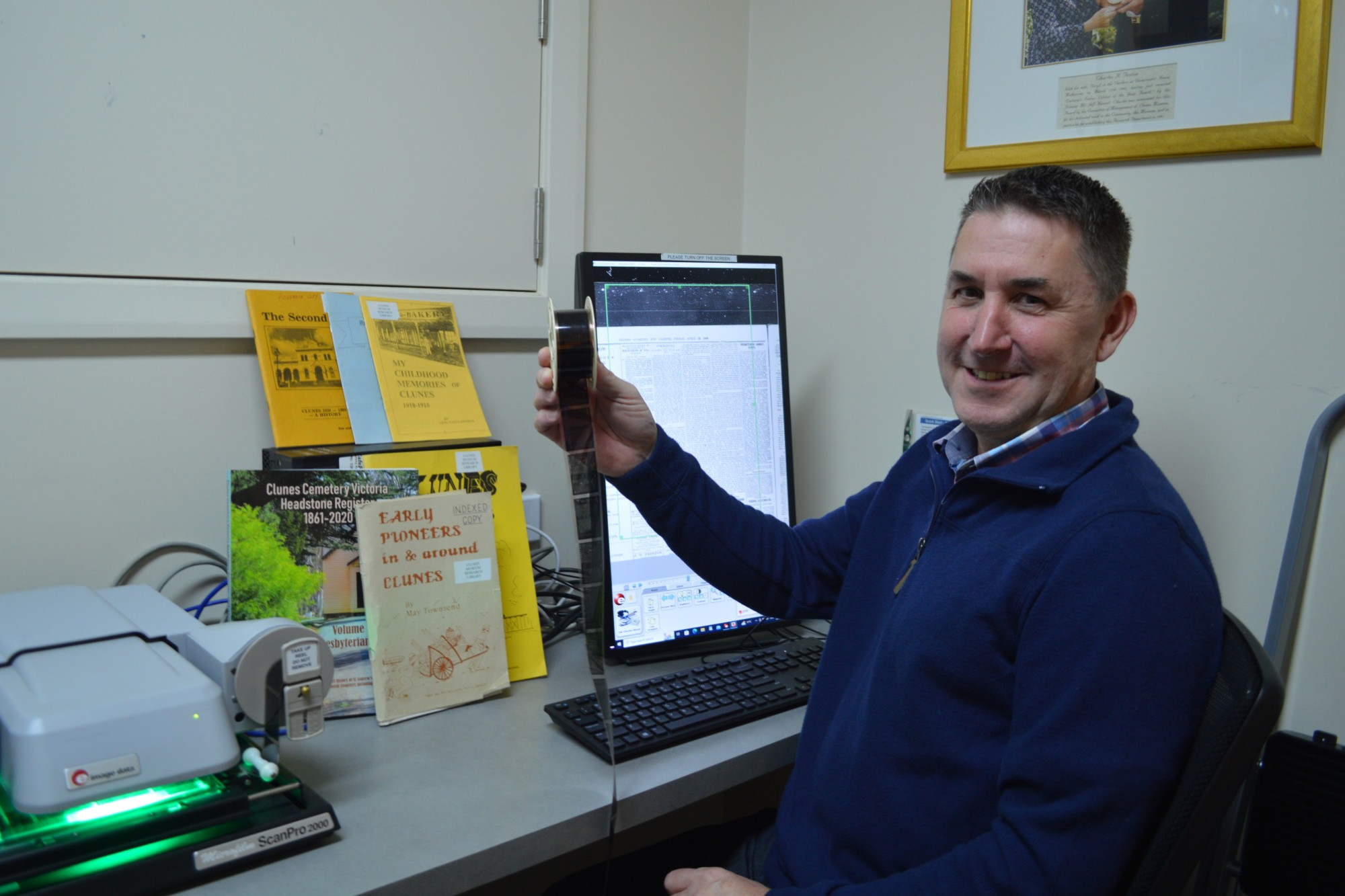 Clunes Museum secretary Peter Spark with some of the microfilm which will be turned in to PDFs.