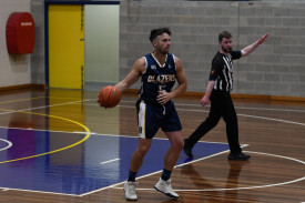 Brady Neill brings the ball up the court. Photo: 101023 22