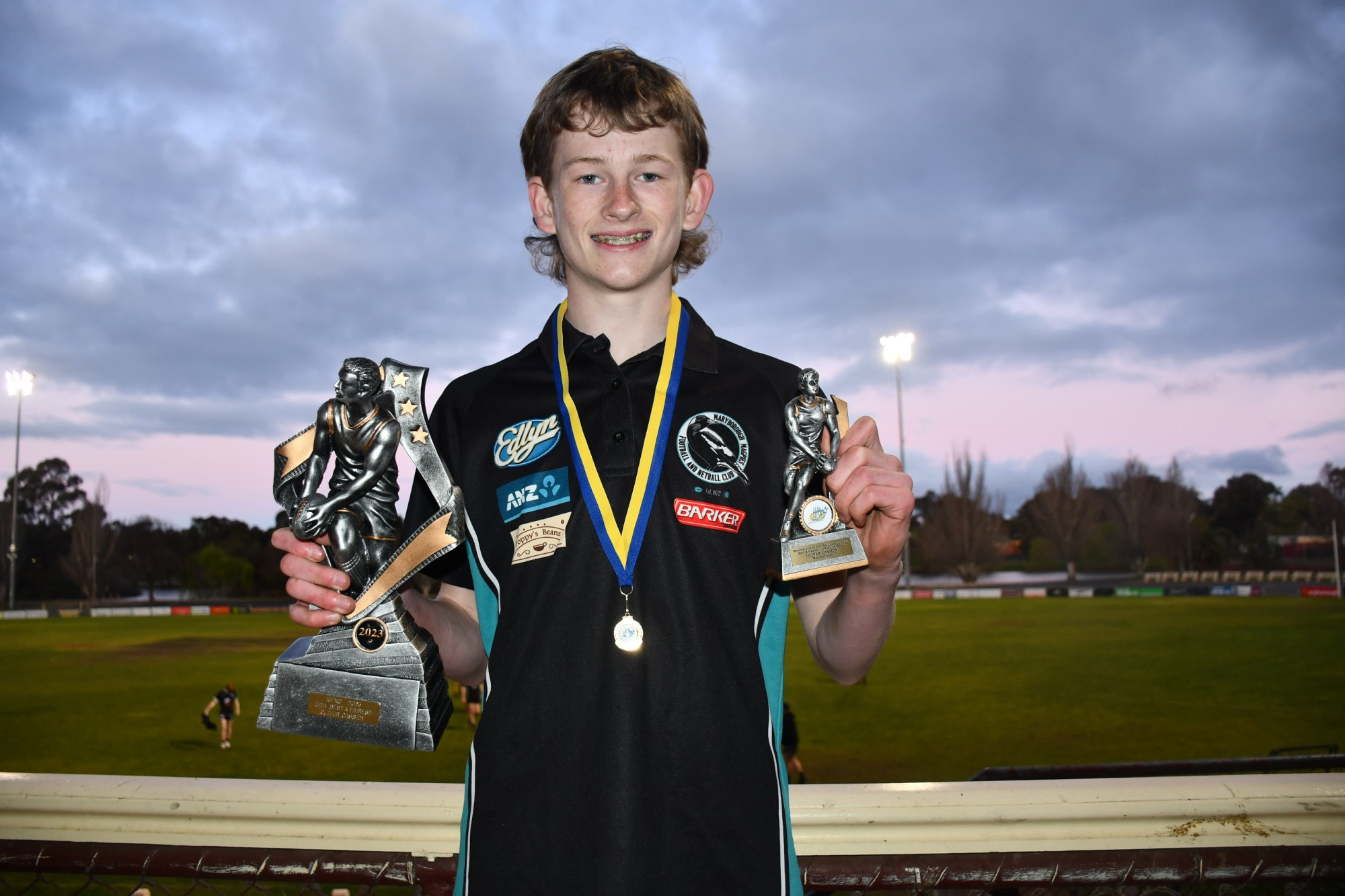 Oliver Cassidy with his twin best and fairest awards from Maryborough FNC and the Bendigo Junior Football League. Photo: 050923 05