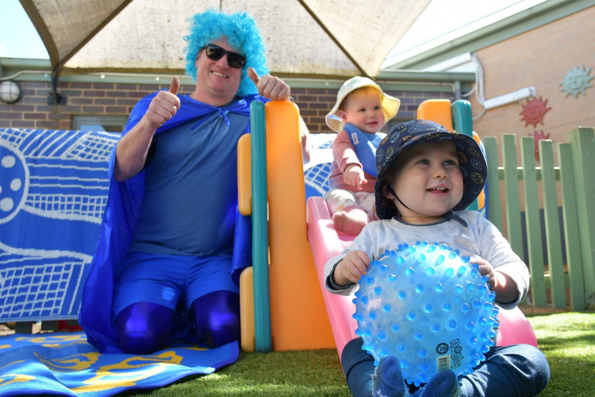 Painting the town blue to mark Dystonia Awareness Month and in support of local Wendy Powell — Mark Bigg, along with Leilani and Ardie, got up to loads of fun at the Goldfields Family Centre this week. Photo: 150923 13