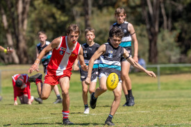 Jayden Gourlay gets away from his South Bendigo opponent. Photo: 190923 44