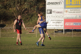 Harcourt’s Cameron Anderson jumps for joy into the arms of teammate Jed Rodda as he kicks a crucial goal in the Lions’ round five win over Carisbrook. Photo: 260923 06