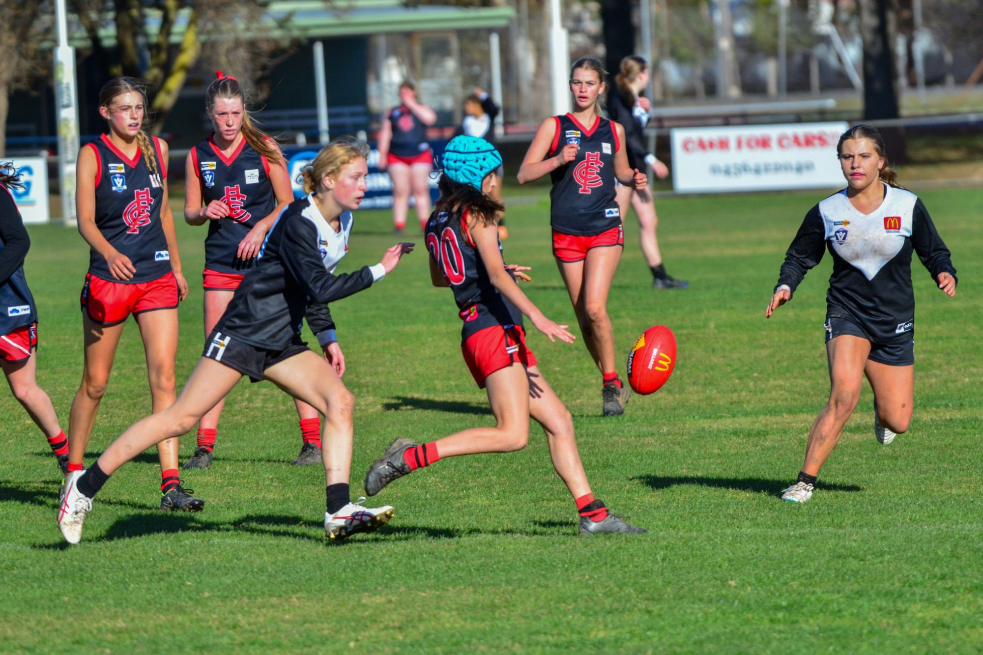 Ava Bartlett sends one forward for the Lady Redbacks under 16s.