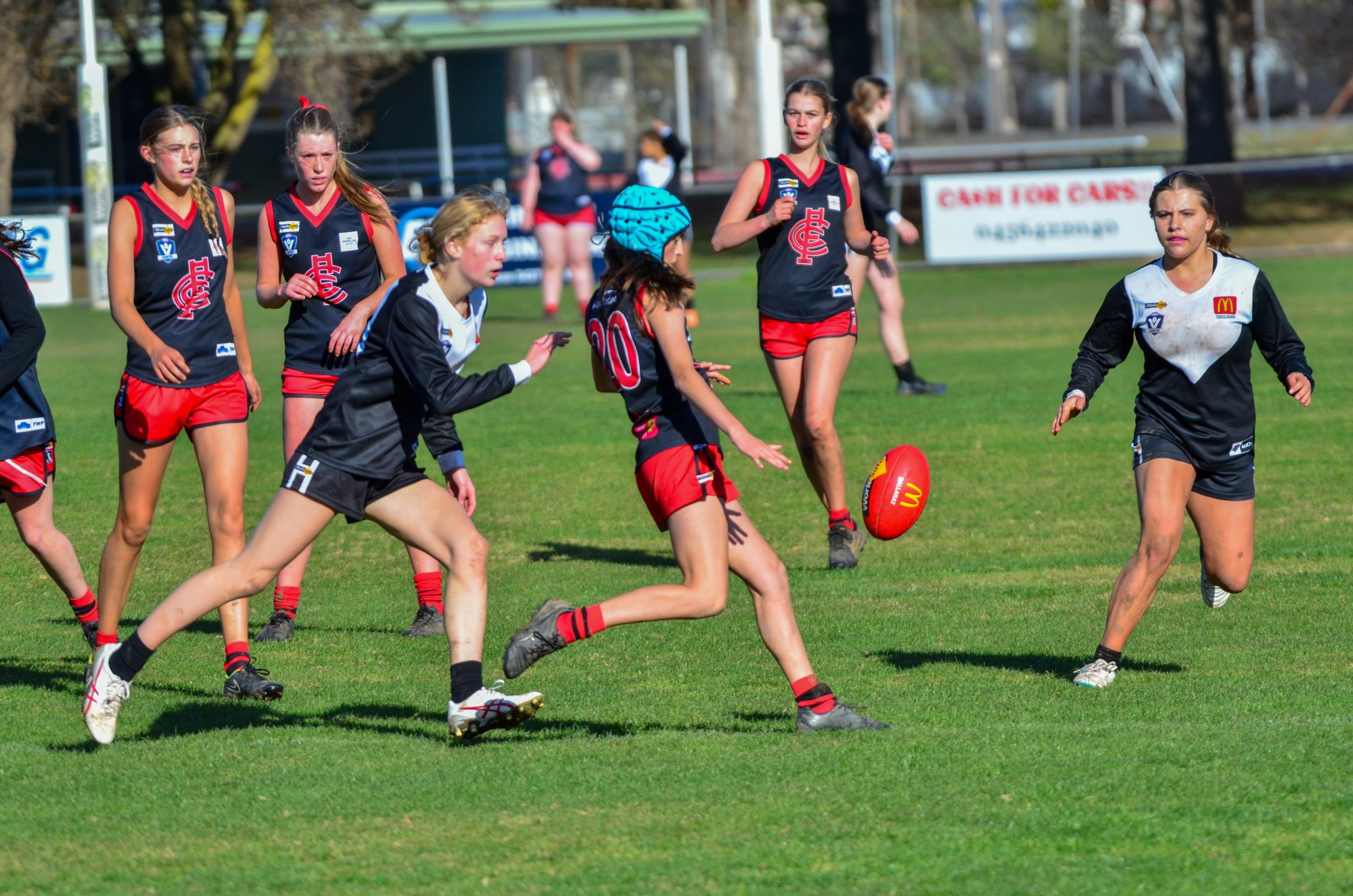 Laylah Smith applies a strong tackle for the Lady Redbacks under 16s.