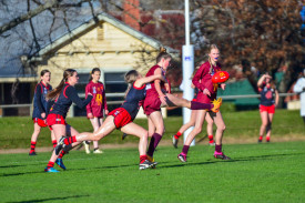 Chloe Wyatt lays a strong tackle for the Redbacks.