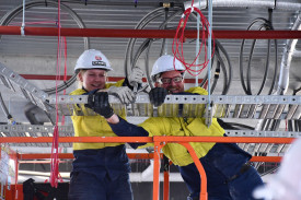 First year electrical apprentice Tayah Doyle and electrician Jarrod Delmenico are hard at work to get the hospital redevelopment project completed by the end of this year.	