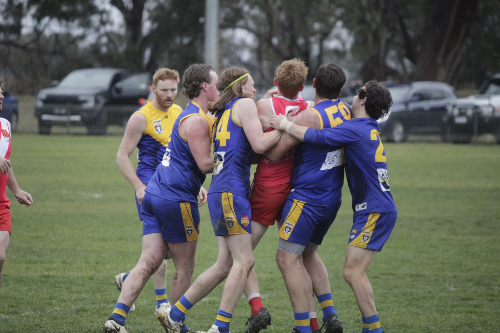 Natte Bealiba’s Jye Mortlock is swarmed on by a group of Lions.